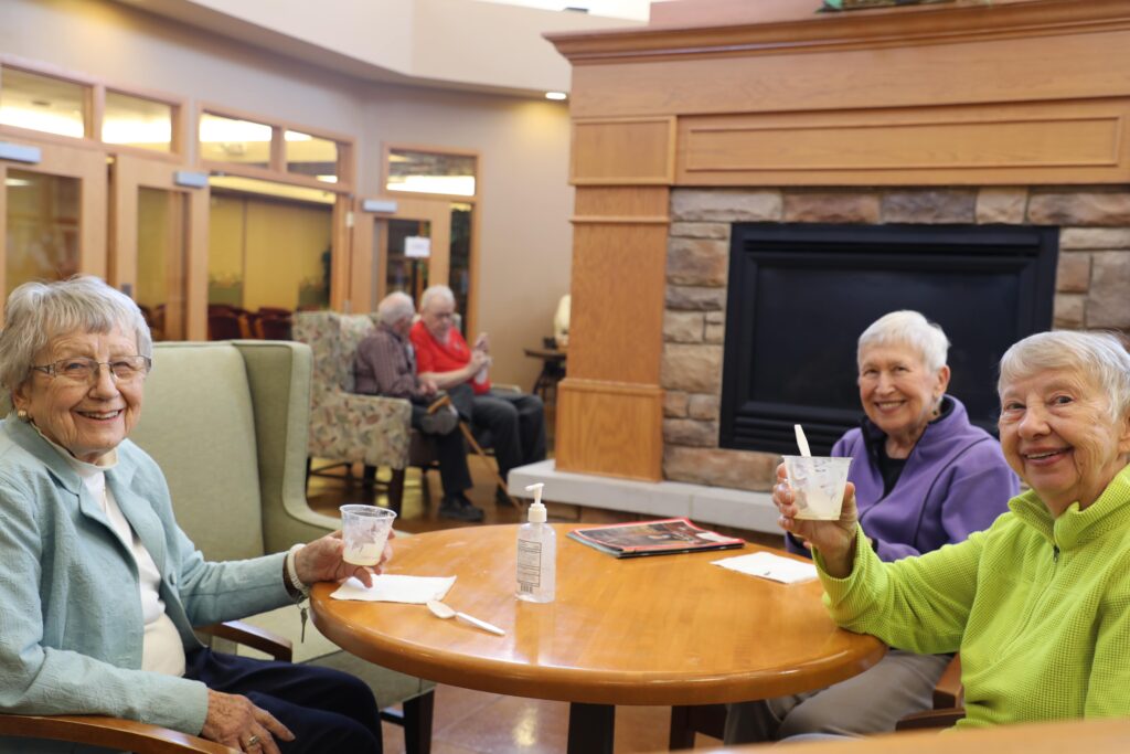 Three Pillars residents spending time together in a common area