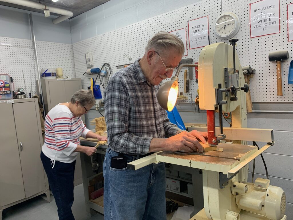 Older adults in woodworking shop