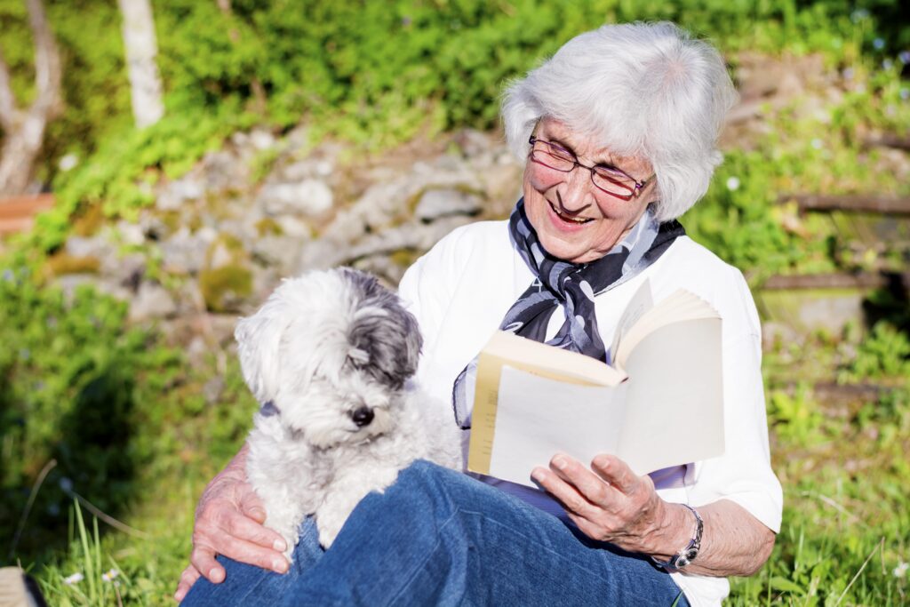 happy elderly woman with dog