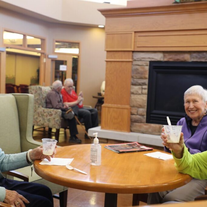 Three Pillars residents spending time together in a common area