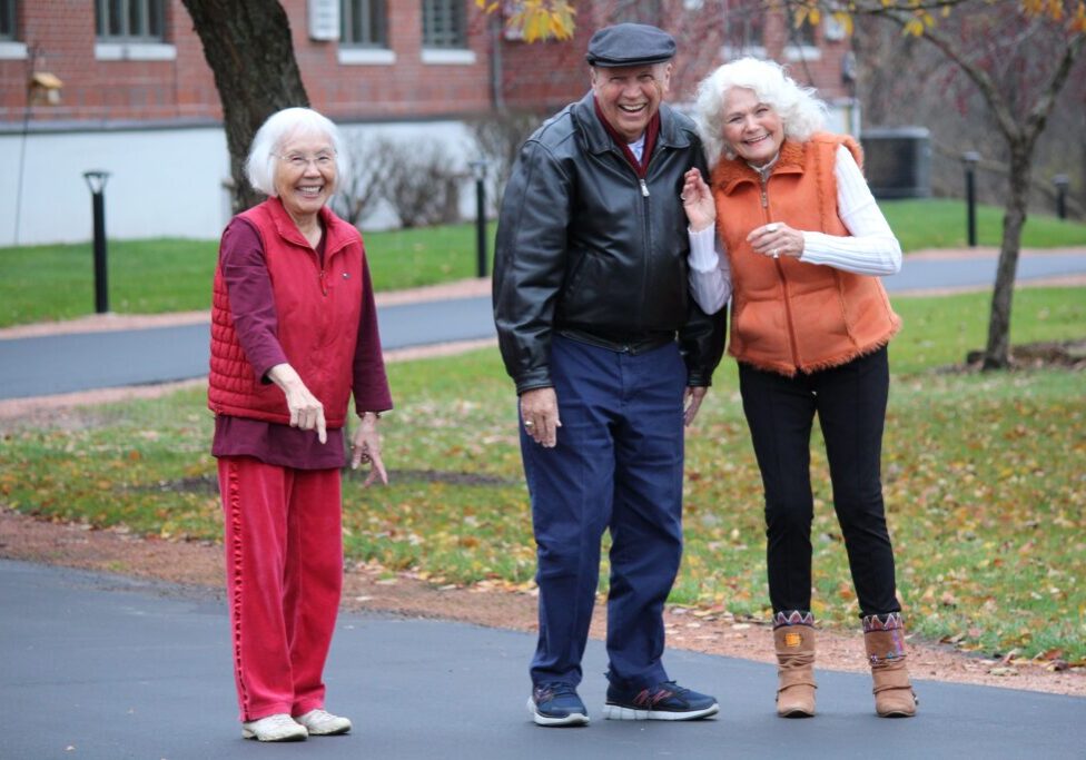 Three Pillars residents enjoying a walk outdoors