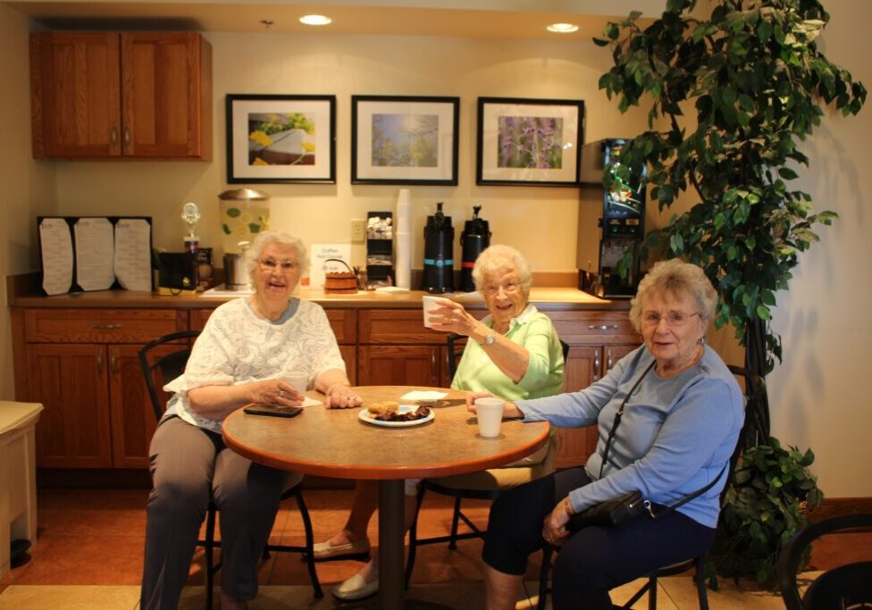 older adult women enjoy drinks together