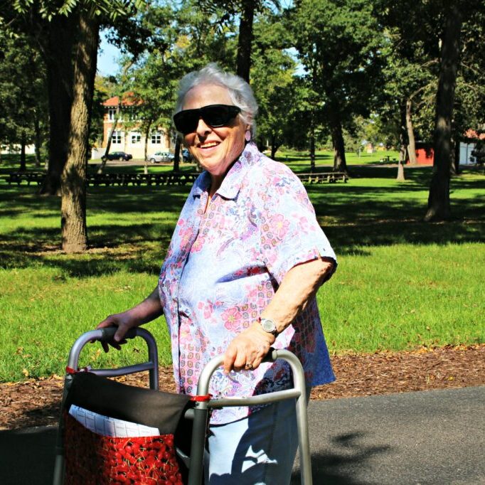 Older adult woman walking outdoors