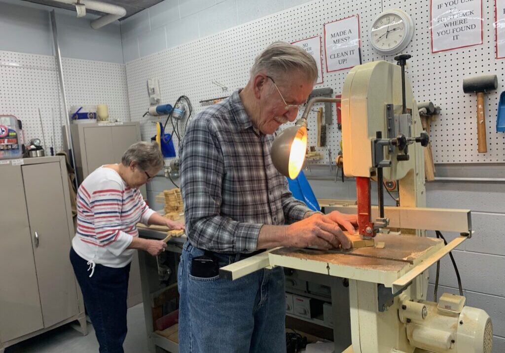 Older adults in woodworking shop