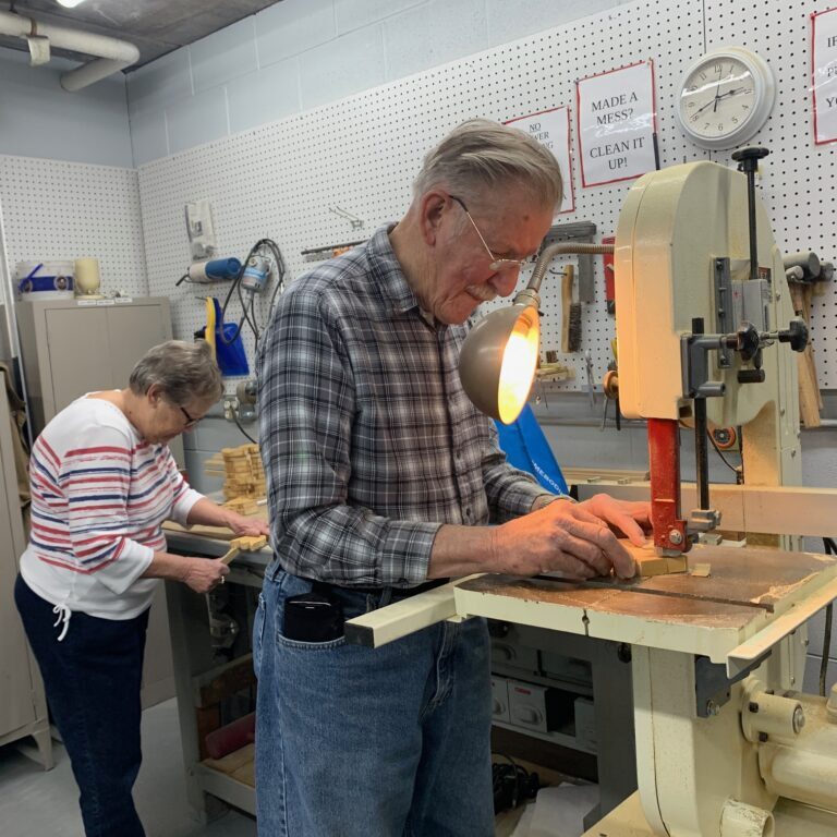 Older adults in woodworking shop