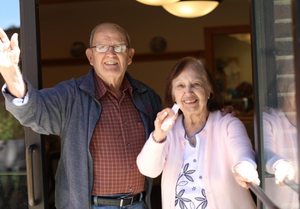 Residents waving happily