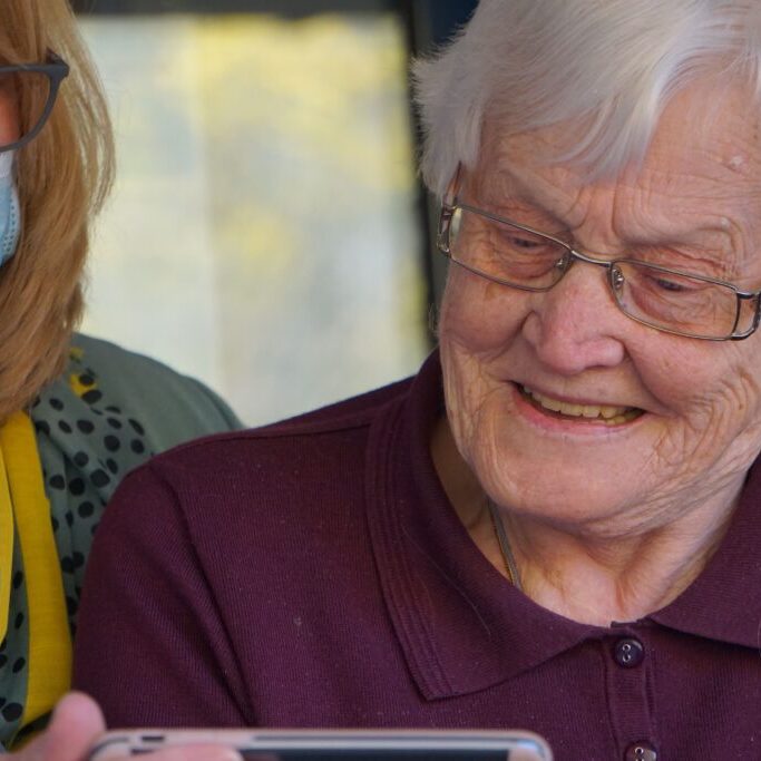 senior living resident with caretaker