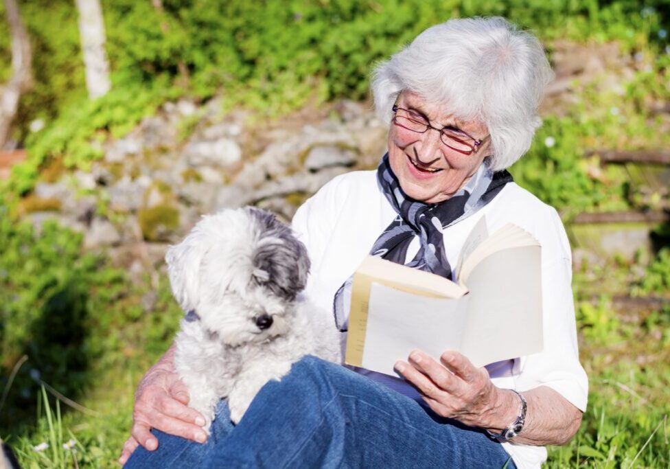 happy elderly woman with dog