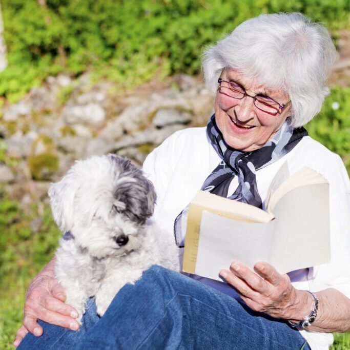 happy elderly woman with dog