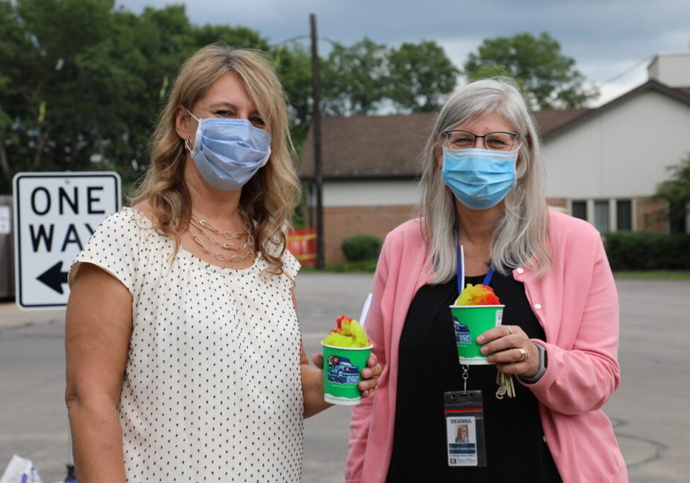 Employees at Three Pillars posing with shave ice