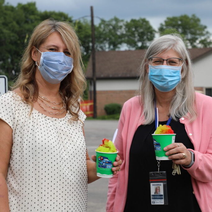 Employees at Three Pillars posing with shave ice