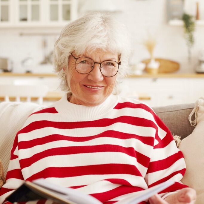 older adult woman reading