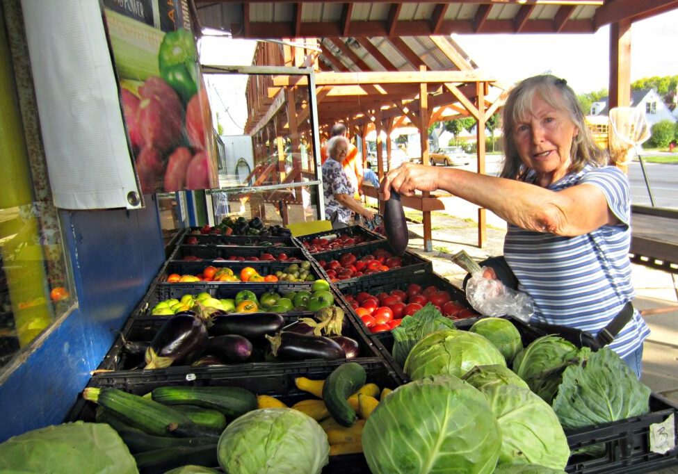 Older adult shopping for produce