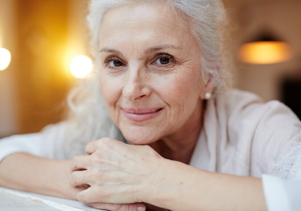 older woman smiling at camera