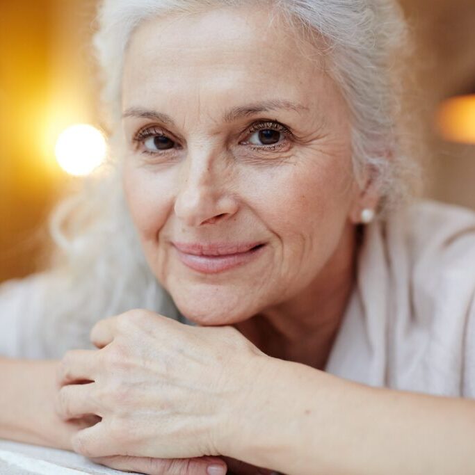 older woman smiling at camera